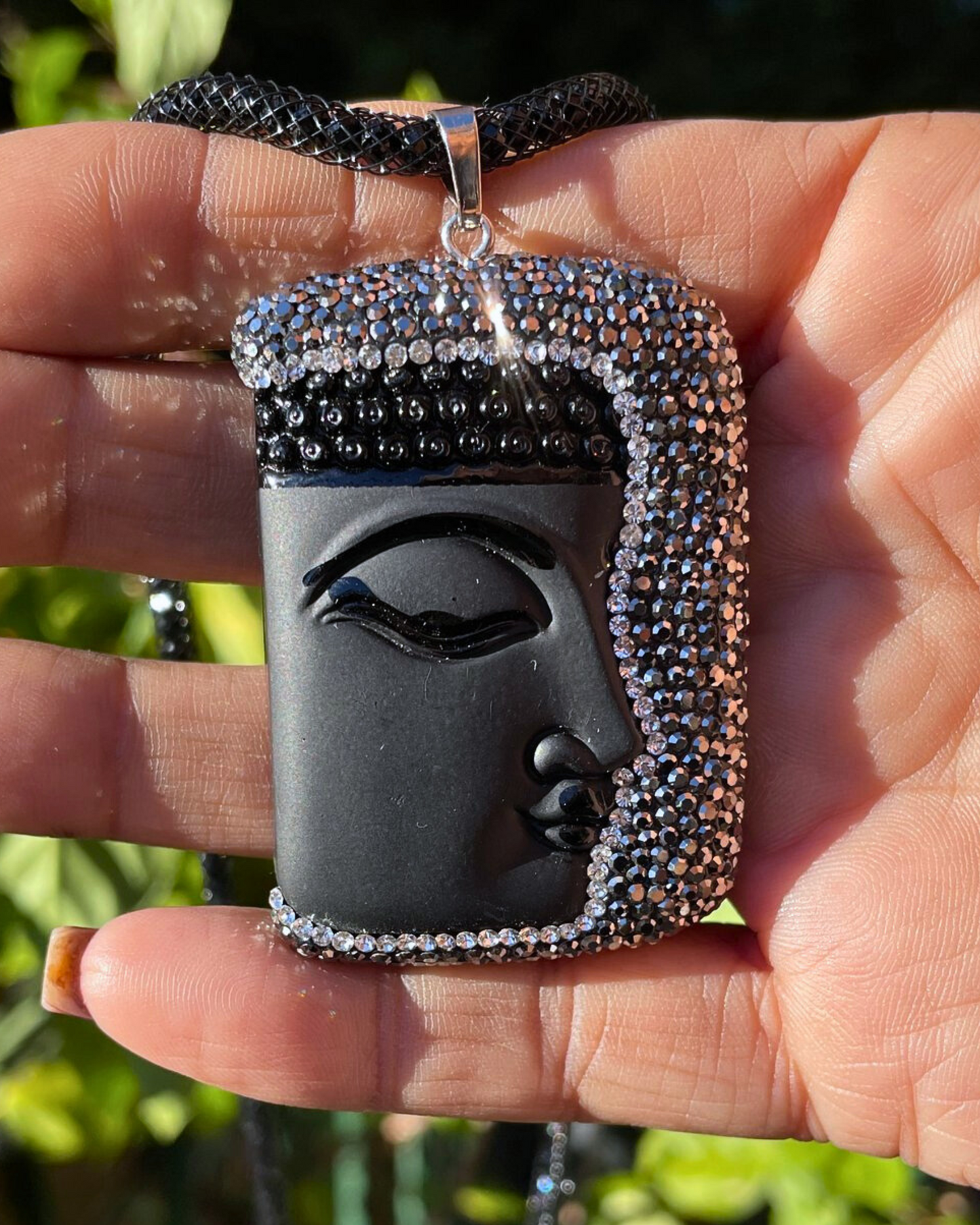 Black Buddha face with Hematite crystals