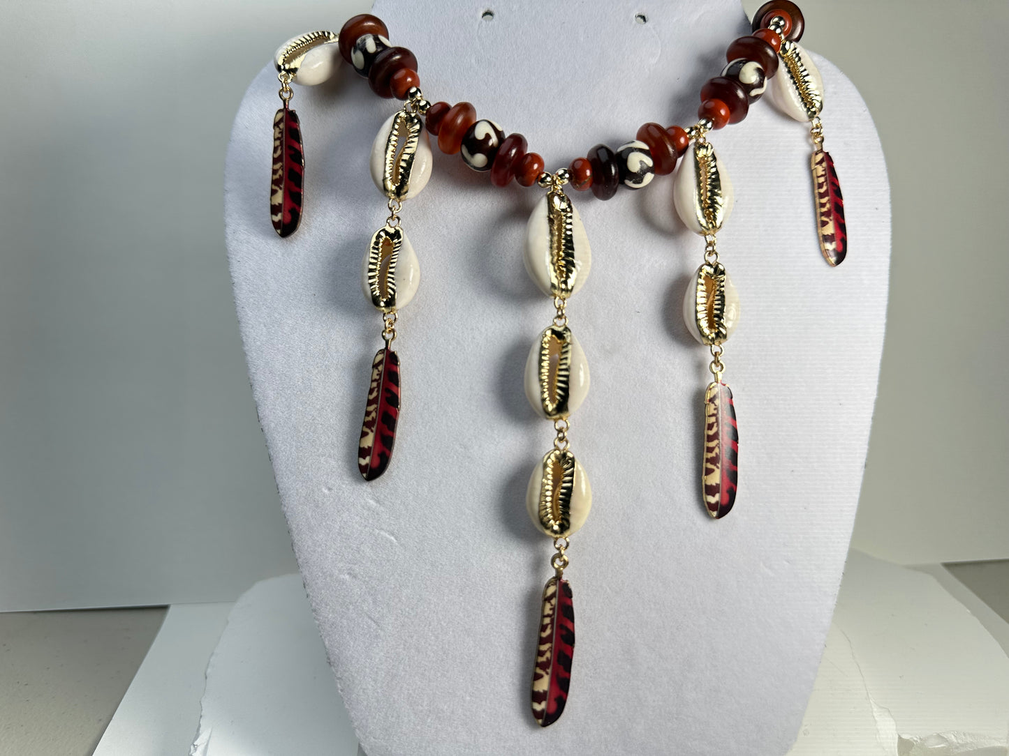 Dripping Cowry Feathers