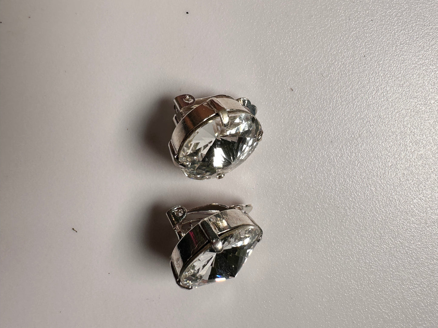 Gold Shade Crystal Drops clip on’s in Silver finish setting.