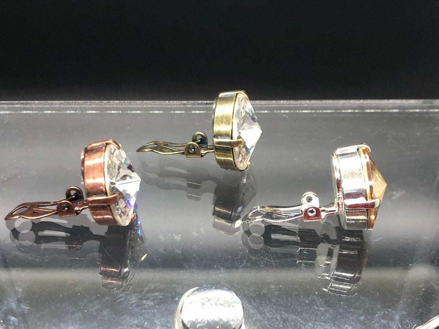 Gold Shade Crystal Drops clip on’s in Silver finish setting.