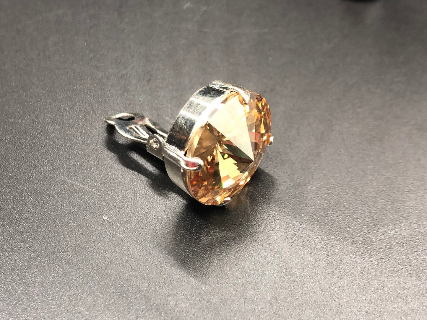 Gold Shade Crystal Drops clip on’s in Silver finish setting.