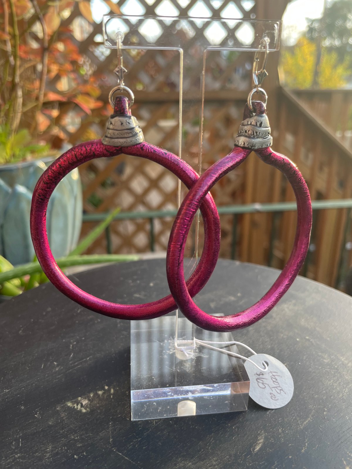 Large Wine/fuchsia Hoops with silver top details.