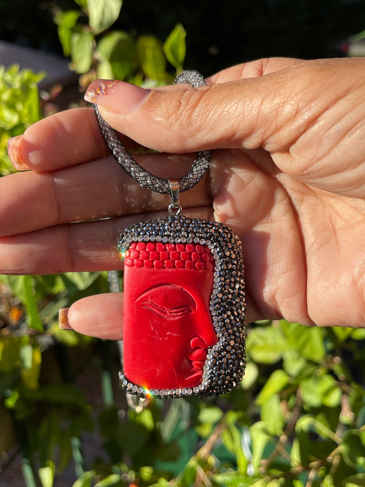 Red Buddha Face Pendant w/ Hematite Crystal