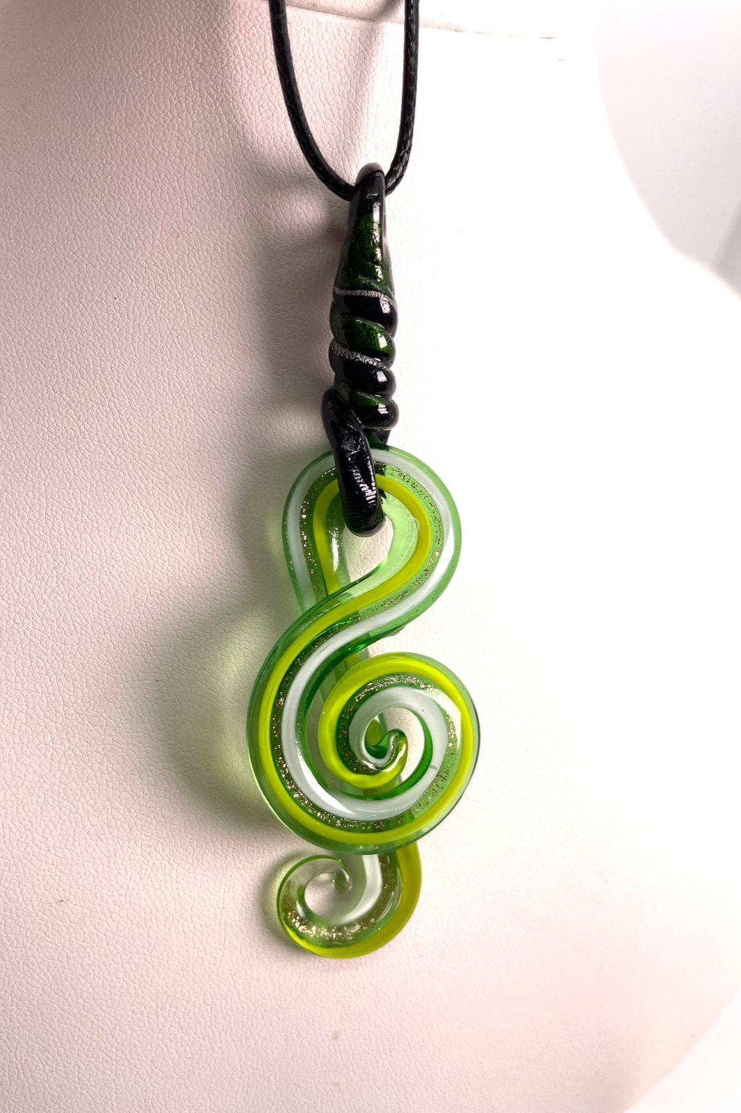 White green blown glass treble clef with through loop top wrap