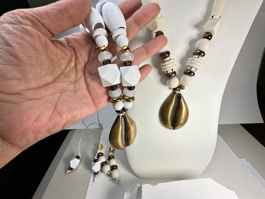 White- Wood You Dare w/ Brass Large Cowry Shell