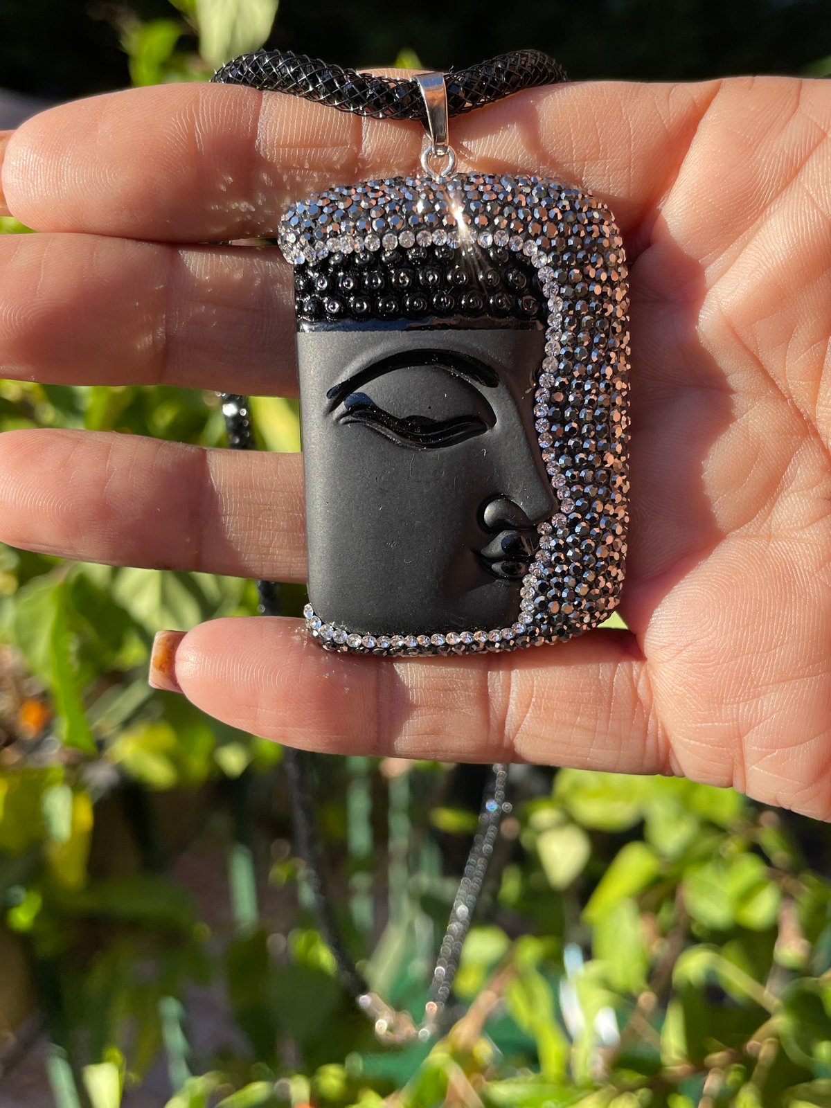 Black Buddha face with Hematite crystals