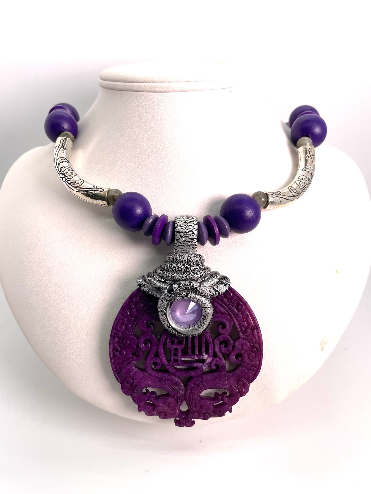 Purple carved Jade on cording